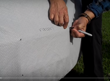 Marking the desired location on fabric cover for Viraport installation
