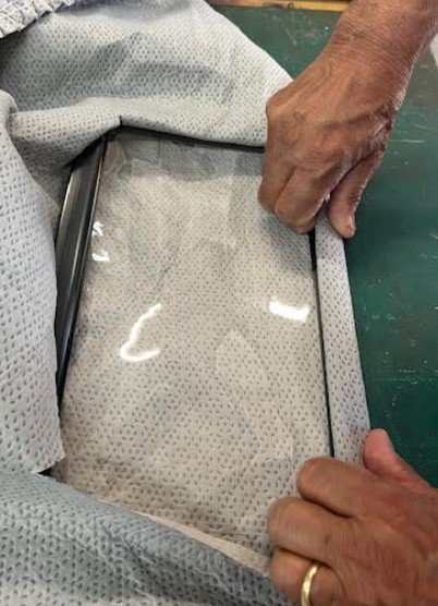 Aligning fabric opening over Viraport clear inspection port