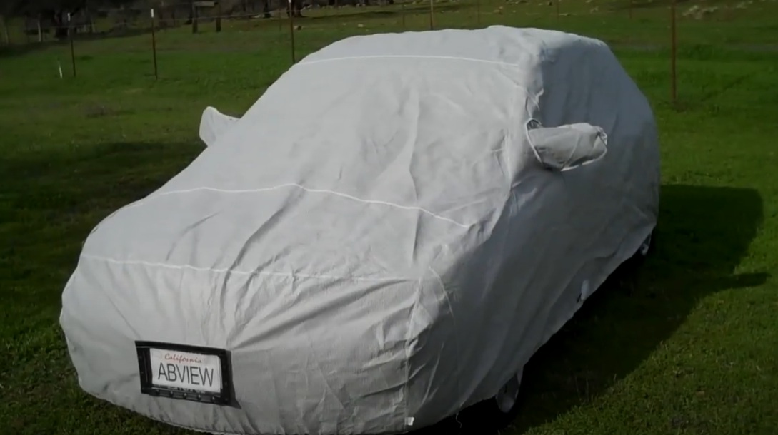 Viraport clear window installed in car cover displaying license plate visibility
